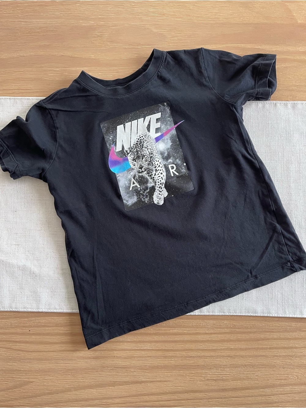 Nike Black Kids Tee with Leopard Graphic and Iridescent Swoosh